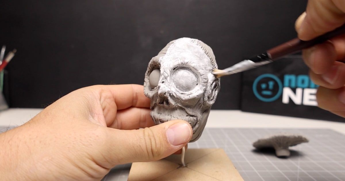 Sealing In The Clay Figure With White Acrylic Paint Wash