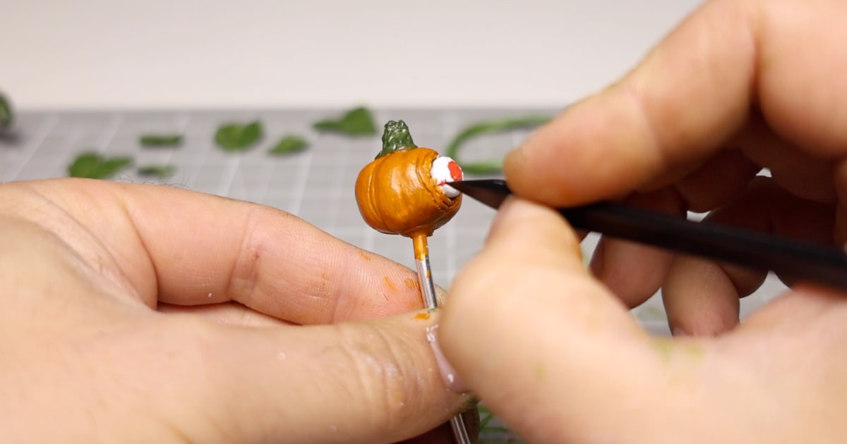 Adding The Details To The Many Scary Mini Pumpkins