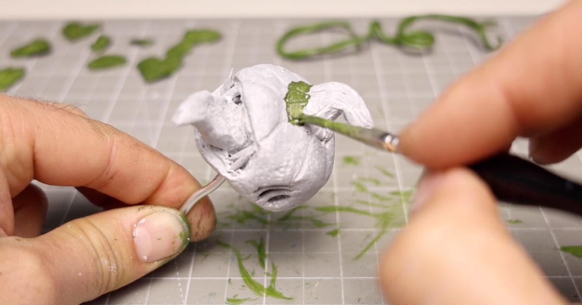 Painting The Pumpkin Tops with a Mix of Green Acrylic Paint