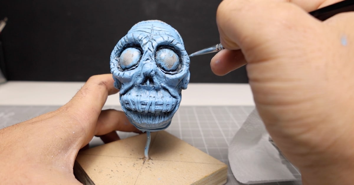 Painting Bob Using Blue Acrylic and Black Acrylic Wash