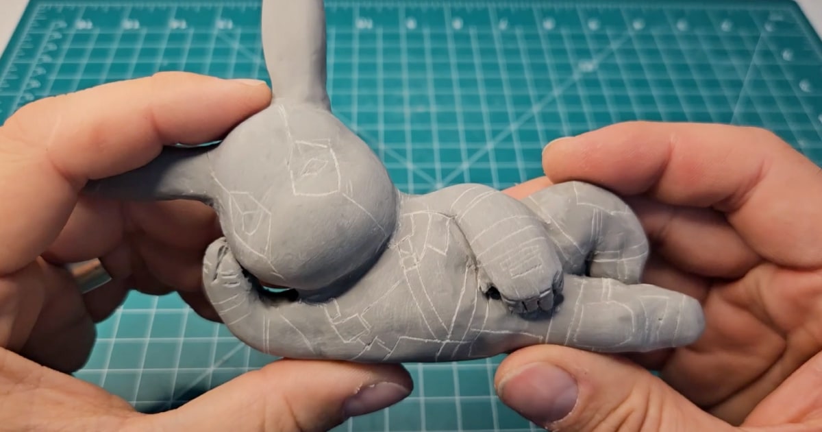 Marking Out The Details On A Baked Clay Pikapool