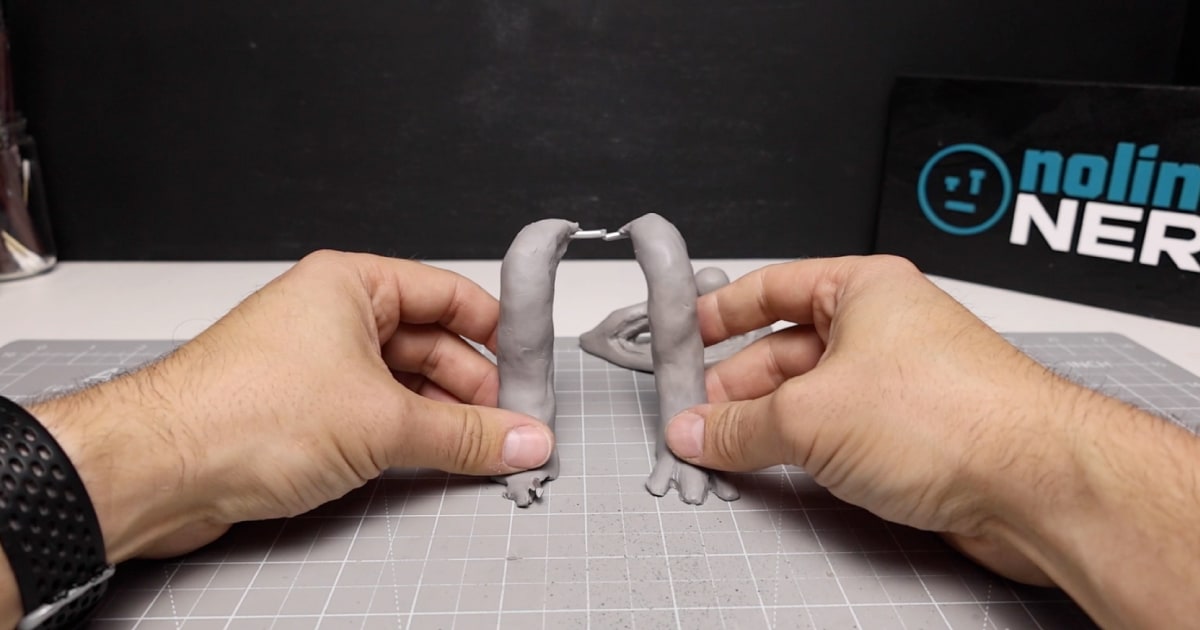 Creating The Legs for Cyan - Tin Foil Wrapped In Clay with Armature Wire to Help Attach