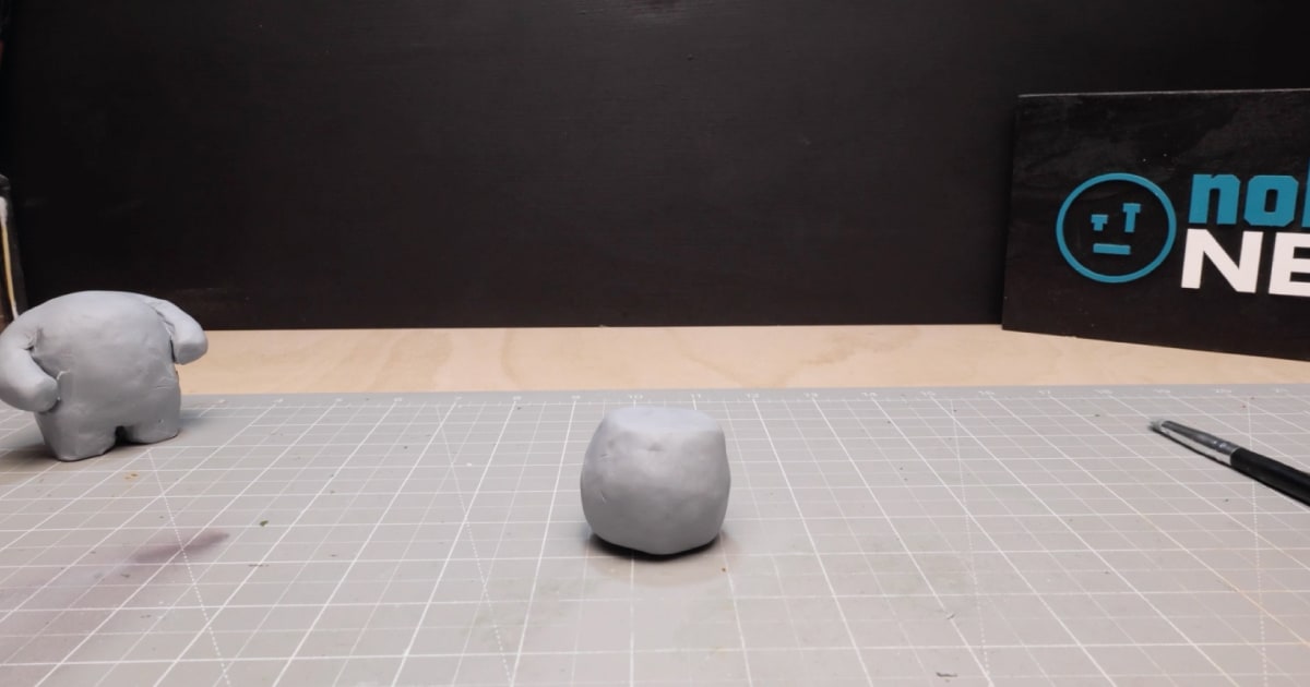 Wrapping The Second Ball of Tin Foil In Clay To Make Santa's Head