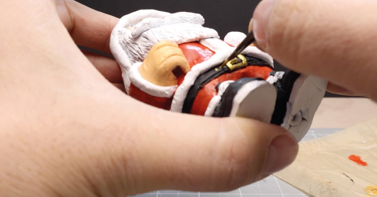 Painting Golden Details on Belt Buckle of My Santa Decoration